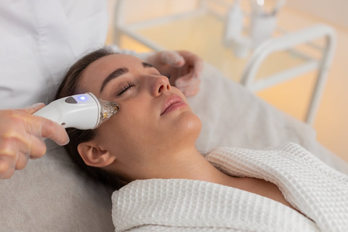 RF radiofrequency facial treatment with professional device for skin tightening and collagen stimulation
