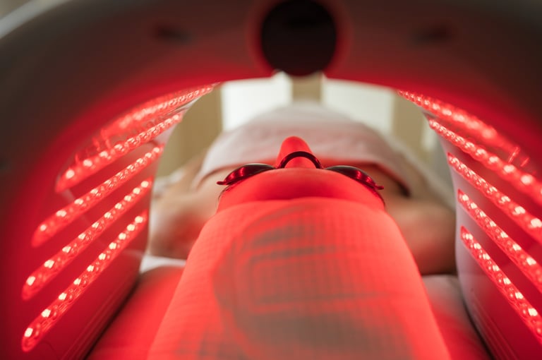 Client enjoying Hydradermabrasian LED light therapy administered by a skilled esthetician in a modern beauty clinic